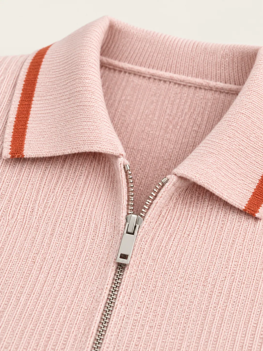 Collared Zip Cardigan, close-up of the zip pull and clay-tipped polo collar