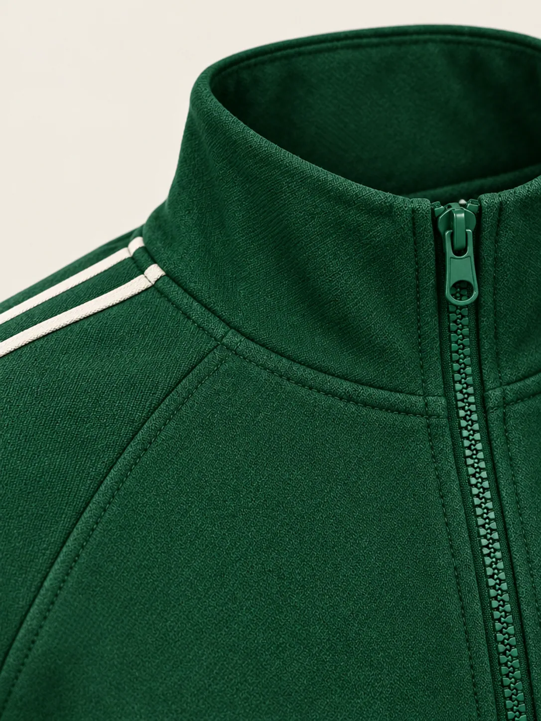 Cropped Track Jacket, close-up of the chalk sleeve piping and zip pull at the collar