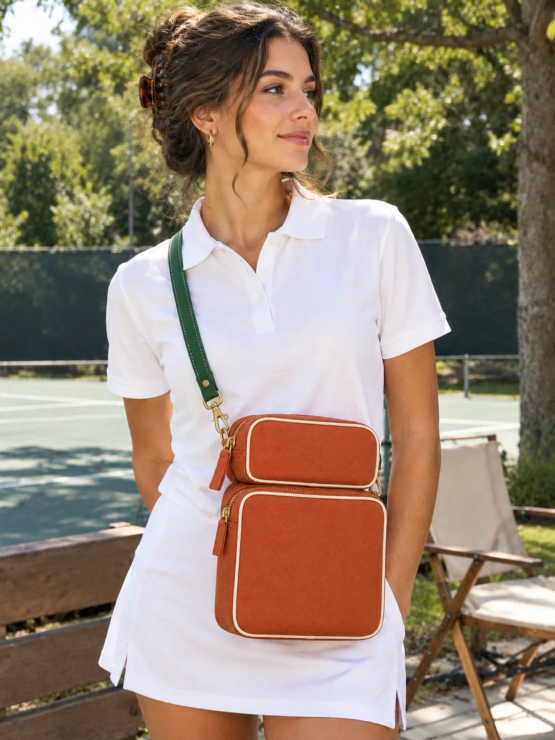 Double-Zip Box Wristlet in Clay, worn at a park tennis court