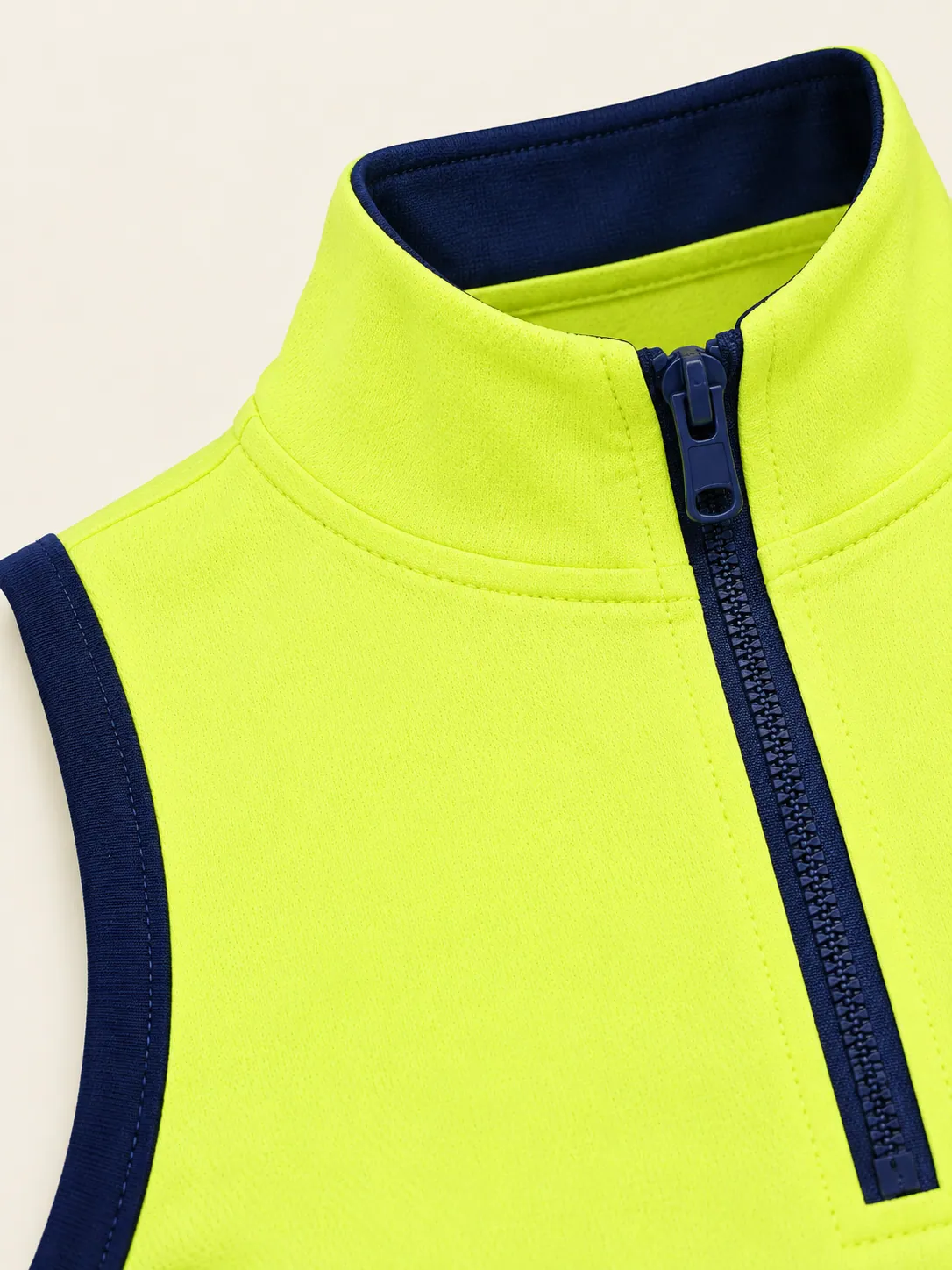 Drop-Shot Zip Polo, close-up of the ink-trimmed zip and mock neck