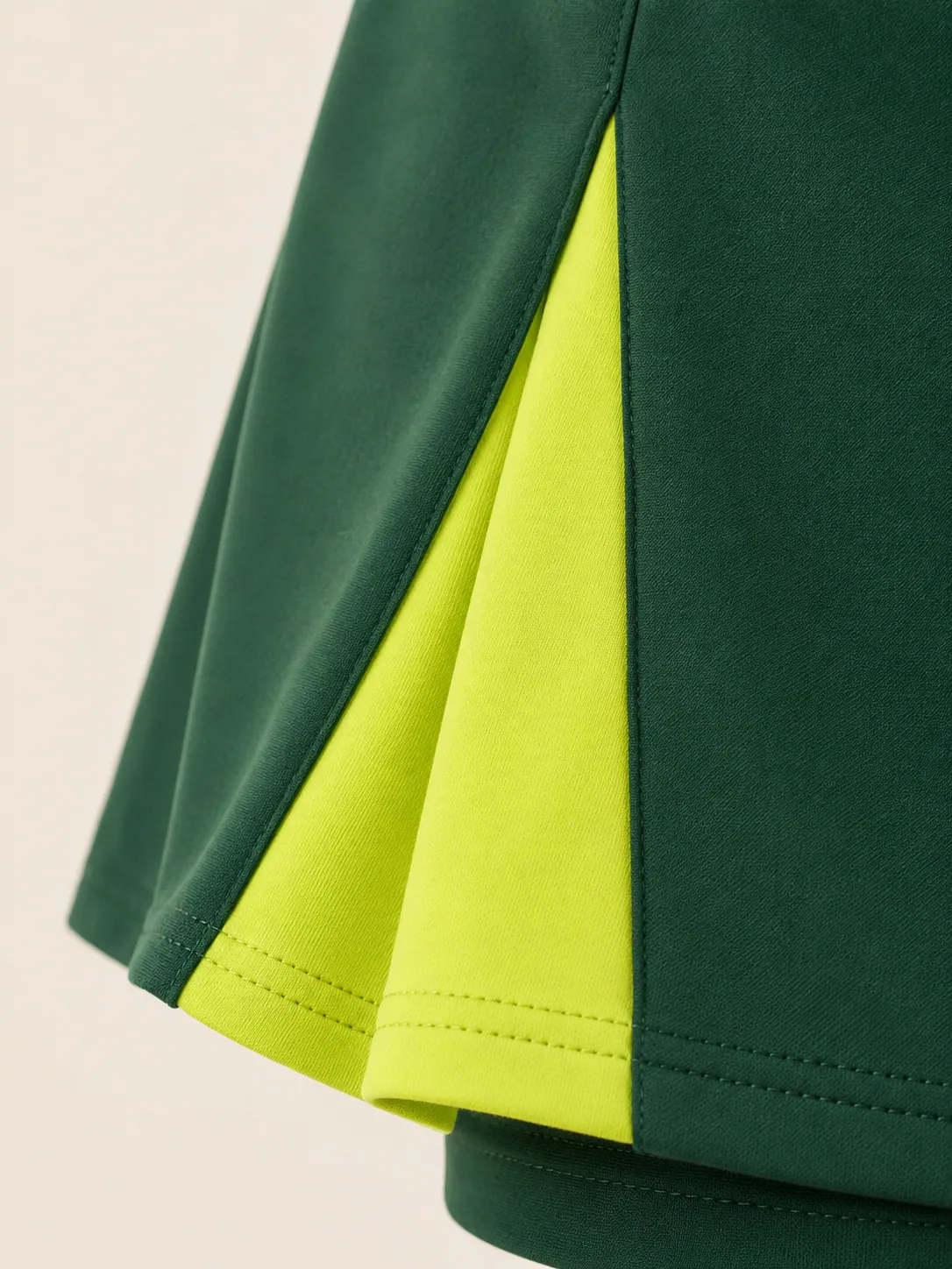 Godet Panel Skort, close-up of the lime godet inset at the hem