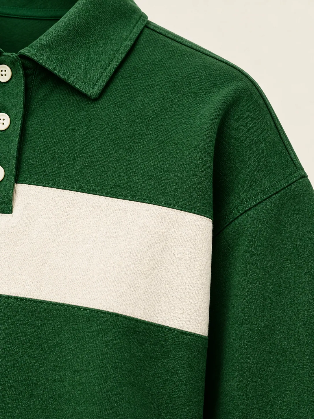 Lob Boxy Polo, close-up of the wide chalk chest stripe meeting the dropped shoulder seam
