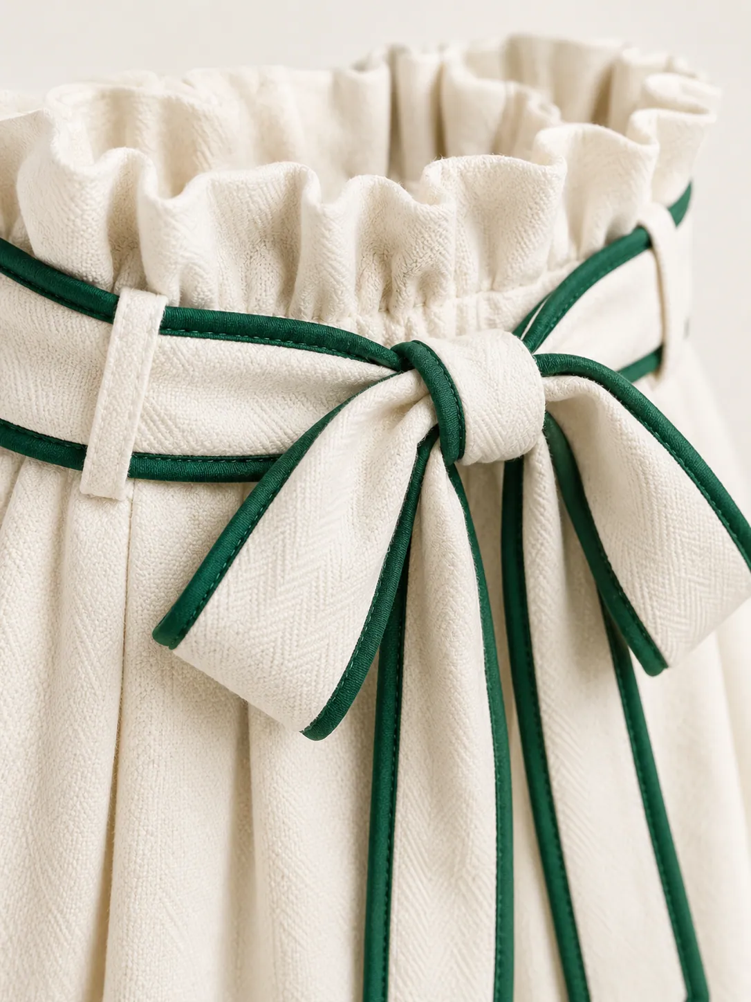Paperbag-Waist Skort, close-up of the paperbag ruffle waist and green-edged tie belt