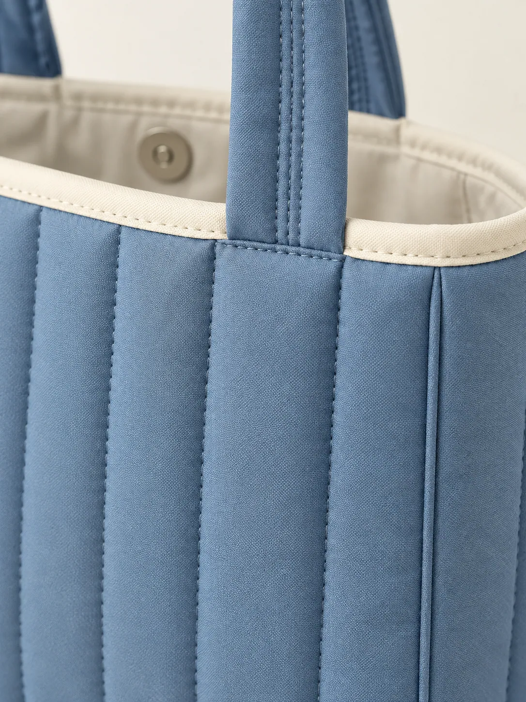 Quilted Mini Tote, close-up of the channel quilting and chalk top binding