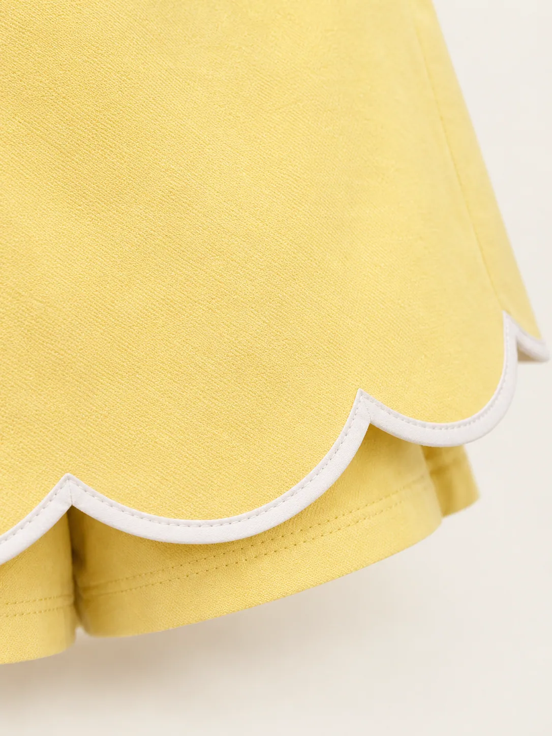 Scallop-Hem Skort, close-up of the chalk-outlined scallops