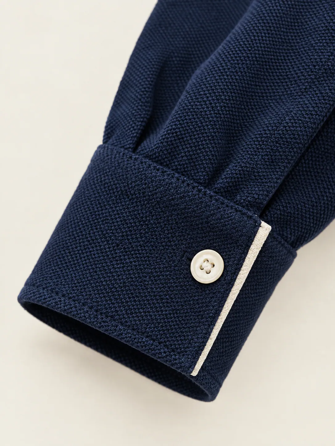 Slice Long-Sleeve Polo, close-up of the buttoned cuff with chalk tipping