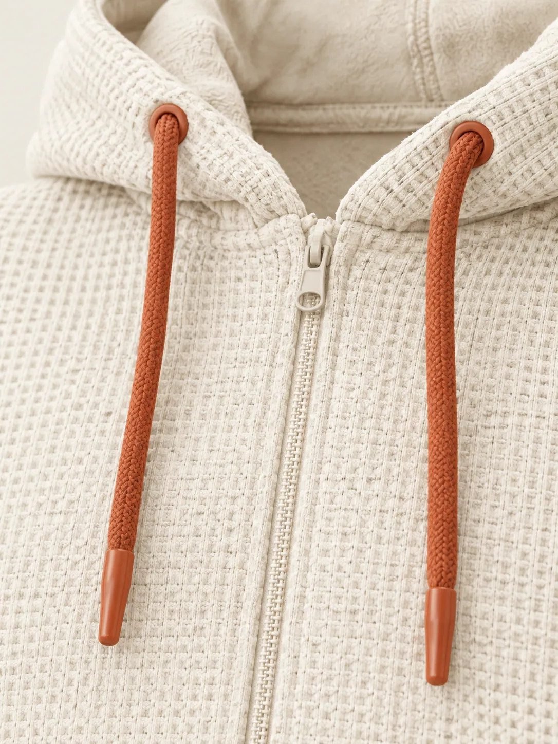 Waffle Zip Hoodie, close-up of the waffle texture and clay-tipped drawcord